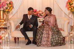 Lovely Indian couple having treats at reception. Lovely Indian couple having treats at reception.