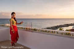 Enchanting Indian bride posing with her sangeet outfit. Enchanting Indian bride posing with her sangeet outfit.