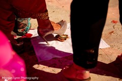 Maharani stepping on a nut at pre-wedding ritual. Maharani stepping on a nut at pre-wedding ritual.