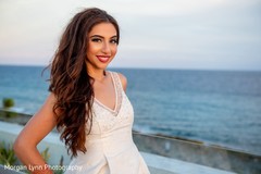 Stunning Indian bride by the beach photo. Stunning Indian bride by the beach photo.