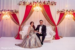 Romantic Indian bride and groom at reception stage. Romantic Indian bride and groom at reception stage.