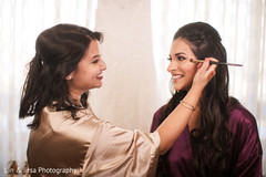 Indian bride getting her makeup done. Indian bride getting her makeup done.