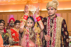 Indian bride throws rice behind her. Indian bride throws rice behind her.