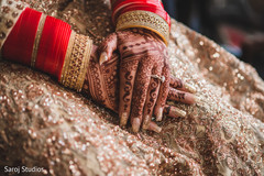 Maharani's hands with ceremony jewelry and mehndi capture. Maharani's hands with ceremony jewelry and mehndi capture.