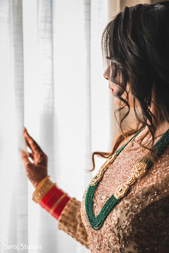 Lovely Indian bride looking out the window. Lovely Indian bride looking out the window.