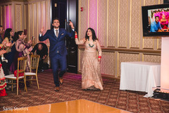 Joyful Indian couple entrance to reception. Joyful Indian couple entrance to reception.