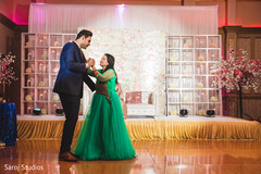 Indian groom dancing with relative capture. Indian groom dancing with relative capture.
