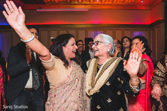 Happy Indian relatives dancing. Happy Indian relatives dancing.