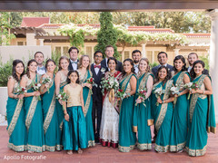 Indian bride and groom posing with special guests Indian bride and groom posing with special guests