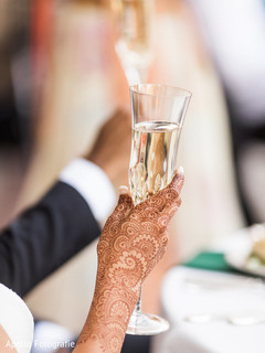 Closeup capture of maharani's holding champagne at reception. Closeup capture of maharani's holding champagne at reception.