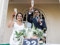 Indian couple cheering up at reception party. Indian couple cheering up at reception party.