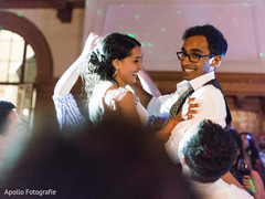 Adorable indian couple dancing during reception Adorable indian couple dancing during reception