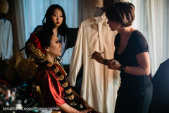 Enchanting Indian bride getting her makeup. Enchanting Indian bride getting her makeup.