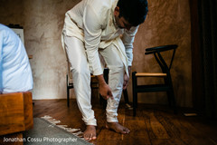 Indian groom getting his Dhoti Kurta fixed. Indian groom getting his Dhoti Kurta fixed.