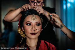 Enchanting Indian bride getting her nose ring on. Enchanting Indian bride getting her nose ring on.