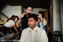 Indian groom getting his hair style. Indian groom getting his hair style.