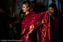 Indian bride getting her ceremony sari on. Indian bride getting her ceremony sari on.