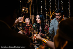 Indian couple cheering up during reception party. Indian couple cheering up during reception party.