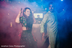 Indian couple at their upbeat sangeet celebration. Indian couple at their upbeat sangeet celebration.
