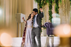 Lovely Indian couple singing at reception party. Lovely Indian couple singing at reception party.