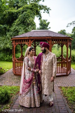 Indian bride and groom posing for pictures Indian bride and groom posing for pictures