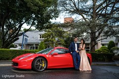 Bride and groom posing outdoors with car Bride and groom posing outdoors with car