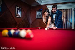 Bride and groom playing pool Bride and groom playing pool