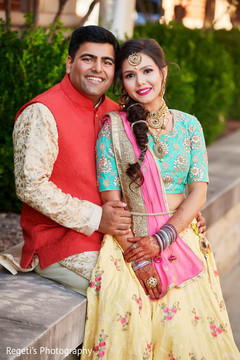 Lovely Indian bride and groom on their sangeet outfits. Lovely Indian bride and groom on their sangeet outfits.