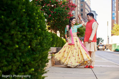 Lovely Indian couple posing on their sangeet outfits. Lovely Indian couple posing on their sangeet outfits.