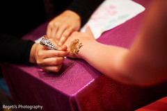 Closeup capture of Indian henna art at pre-wedding celebration. Closeup capture of Indian henna art at pre-wedding celebration.