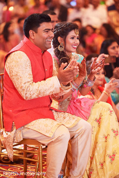 Sweet Indian couple during their sangeet. Sweet Indian couple during their sangeet.