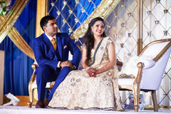 Indian couple listening to their wedding speech. Indian couple listening to their wedding speech.