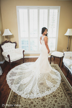 Elegant Indian bride in white lace dress. Elegant Indian bride in white lace dress.