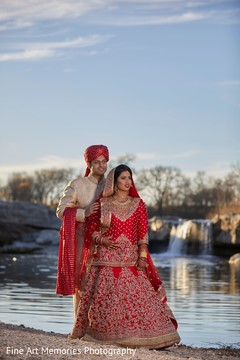 Indian bride and groom posing for the photo shoot Indian bride and groom posing for the photo shoot