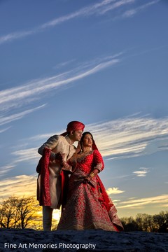 Indian bride and groom posing for pictures Indian bride and groom posing for pictures