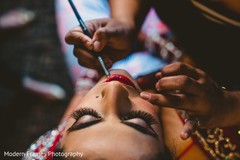 Indian bride getting her makeup done. Indian bride getting her makeup done.