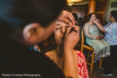 Indian relatives getting their makeup done. Indian relatives getting their makeup done.