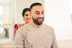 Joyful Indian groom meeting his bride for the first look. Joyful Indian groom meeting his bride for the first look.