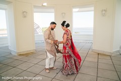 Indian groom admiring bridal mehndi art. Indian groom admiring bridal mehndi art.