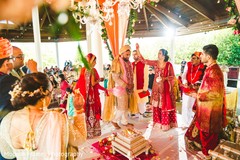 Indian bride walking behind groom at ceremony ritual. Indian bride walking behind groom at ceremony ritual.
