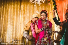 Indian groom walking behind bride at ceremony. Indian groom walking behind bride at ceremony.