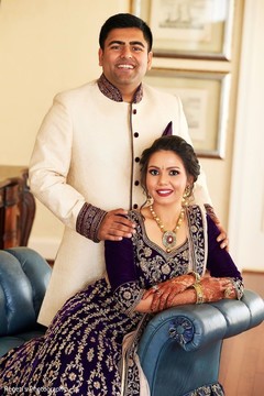Indian couple posing on their wedding ceremony outfits. Indian couple posing on their wedding ceremony outfits.