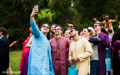 Indian groomsmen taking a selfie at baraat procession. Indian groomsmen taking a selfie at baraat procession.