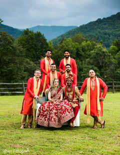 Indian lovebirds posing outdoors with groomsmen. Indian lovebirds posing outdoors with groomsmen.