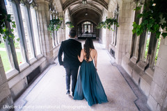 Indian bride and groom walking during the photo shoot Indian bride and groom walking during the photo shoot