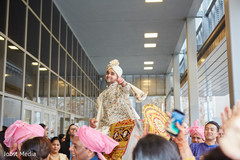 Elegant Indian groom riding baraat white horse. Elegant Indian groom riding baraat white horse.