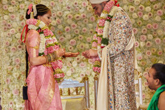 Indian bride putting ring to groom. Indian bride putting ring to groom.