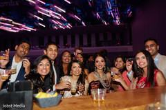 Joyful Indian bride posing with guests capture. Joyful Indian bride posing with guests capture.