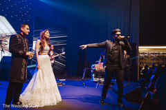 Enchanting Indian couple at reception singer's performance. Enchanting Indian couple at reception singer's performance.