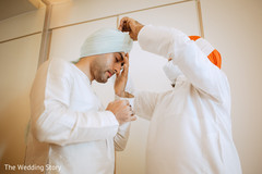 Enchanting Indian groom getting his turban on. Enchanting Indian groom getting his turban on.